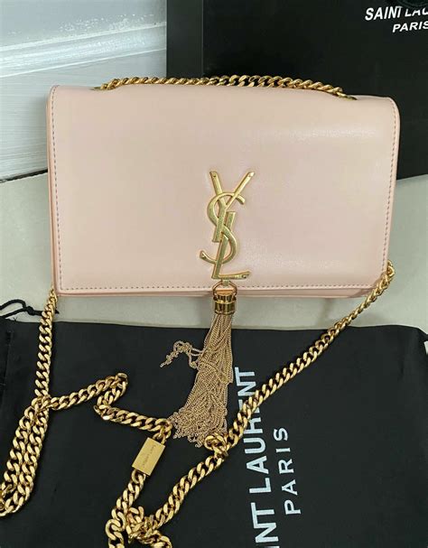 pink yves saint laurent bag.